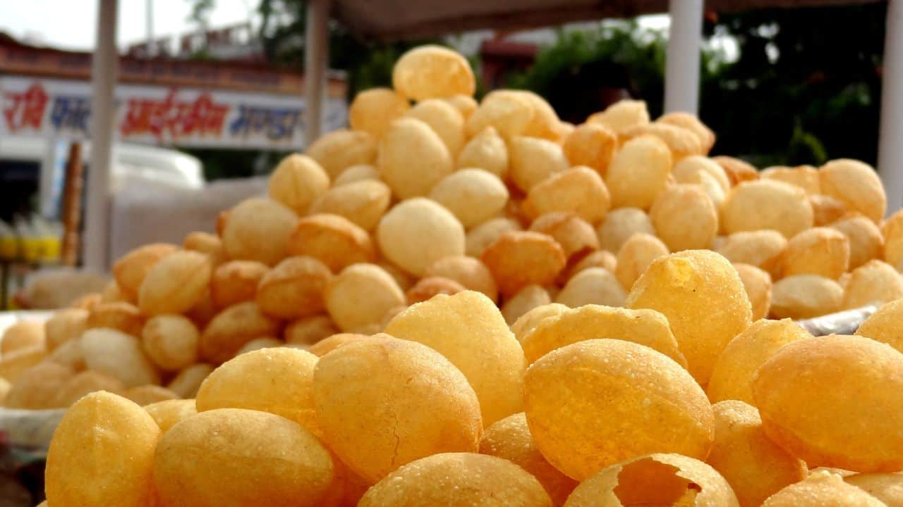 A-close-up-of-crispy-fried-dough-balls-arranged-in-a-neat-pile-showcasing-a-popular-snack-in-Jaipur-India.jpg
