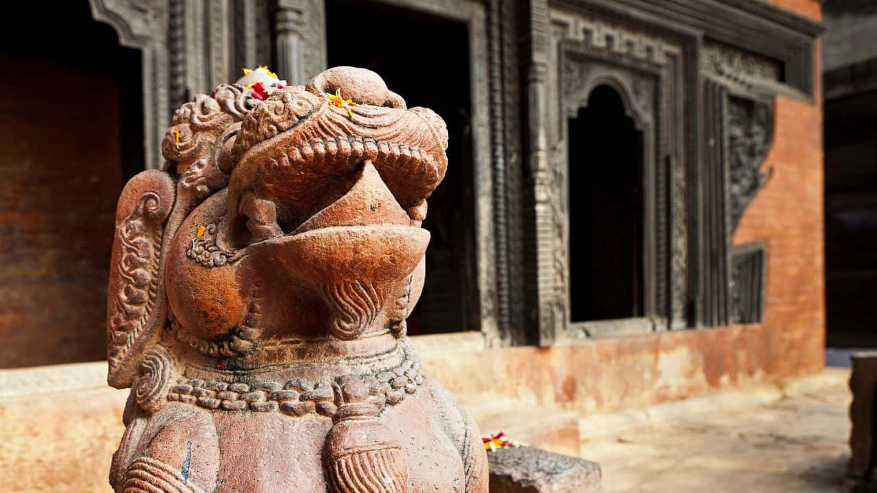 A-majestic-lion-statue-is-positioned-before-a-temple-in-Varanasi-India.jpg