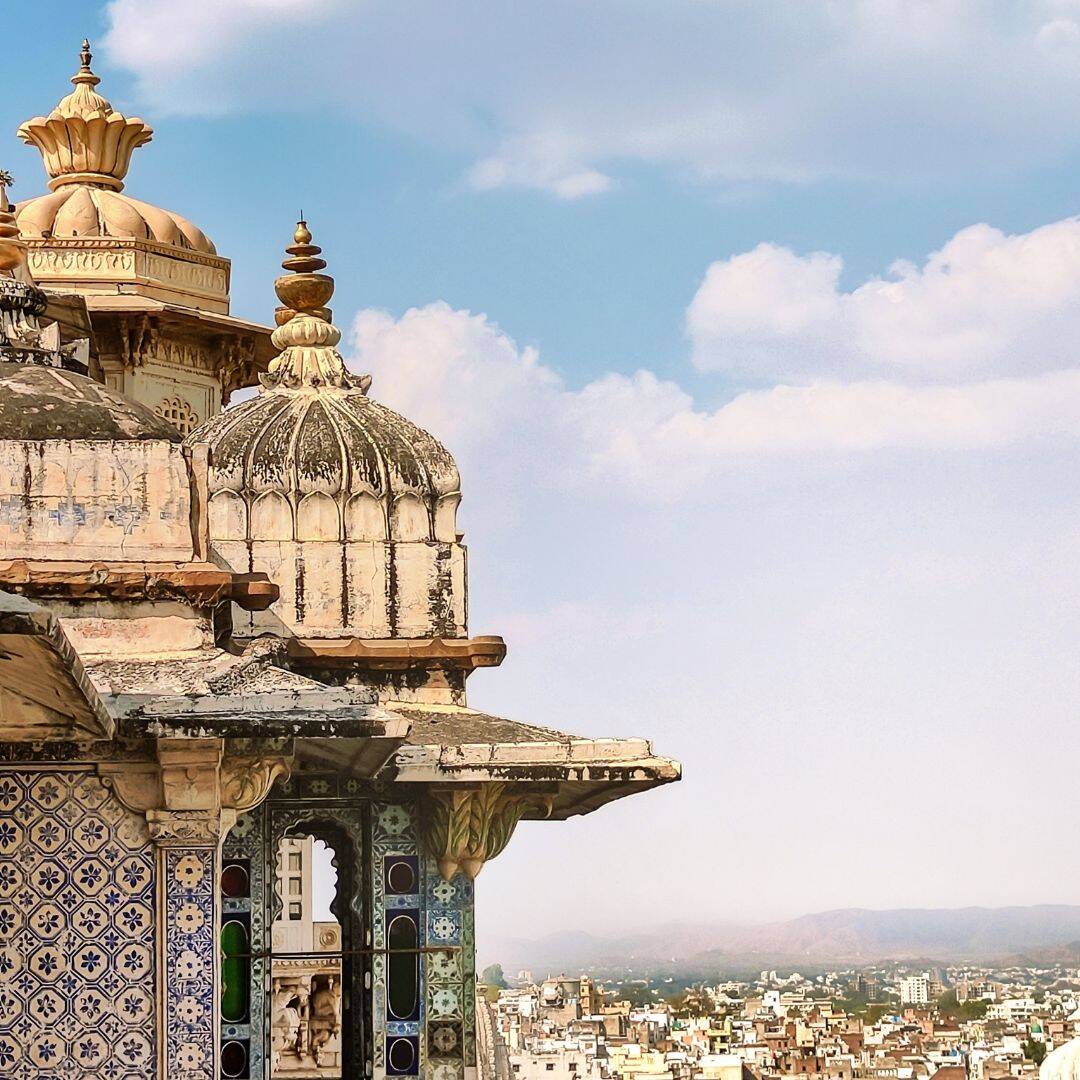 A panoramic view of Udaipur city, India, showcasing its architecture and landscape from the top of a tall building A panaromic view of Udaipur city India showcasing its architecture and landscape from the top a tall building