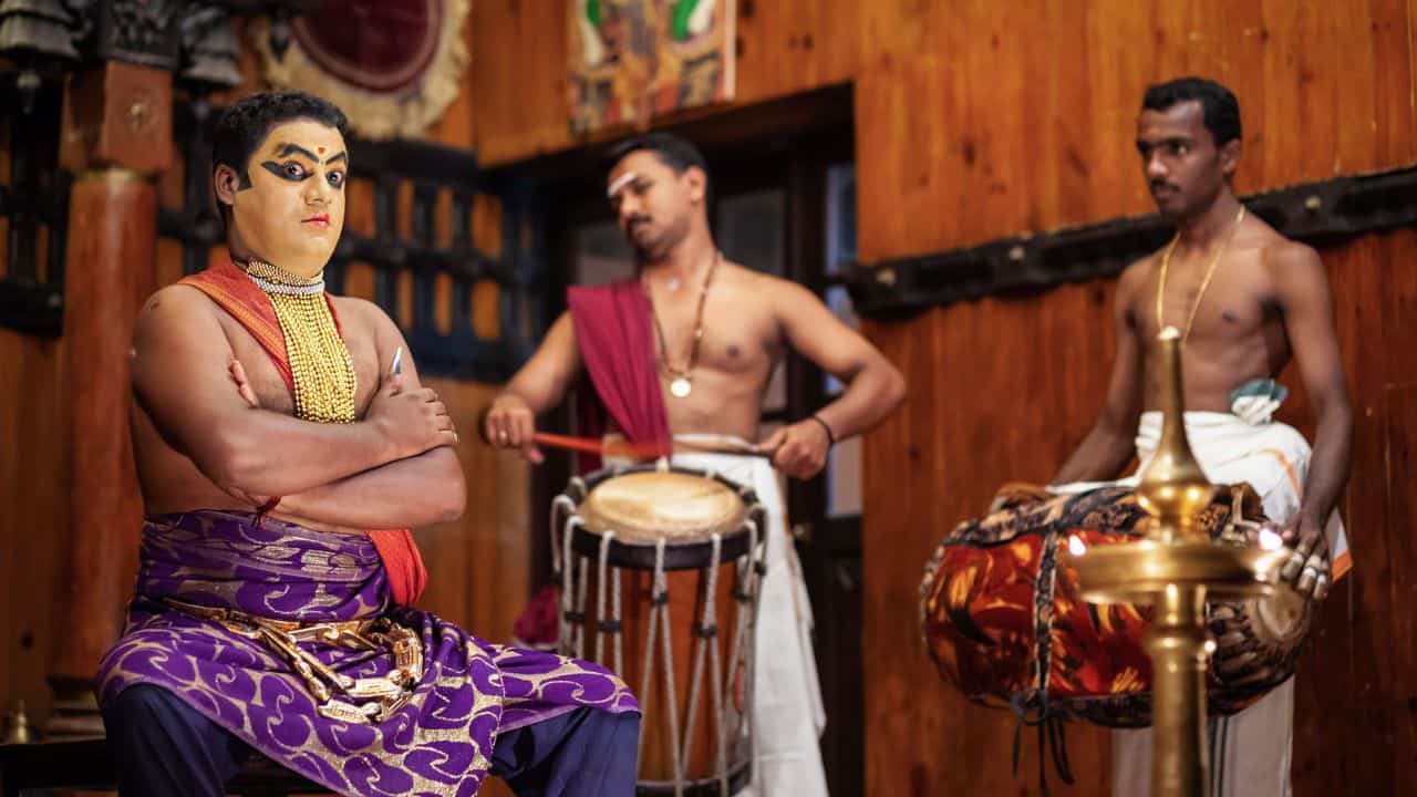 A-performer-in-traditional-Kathakali-attire.jpg