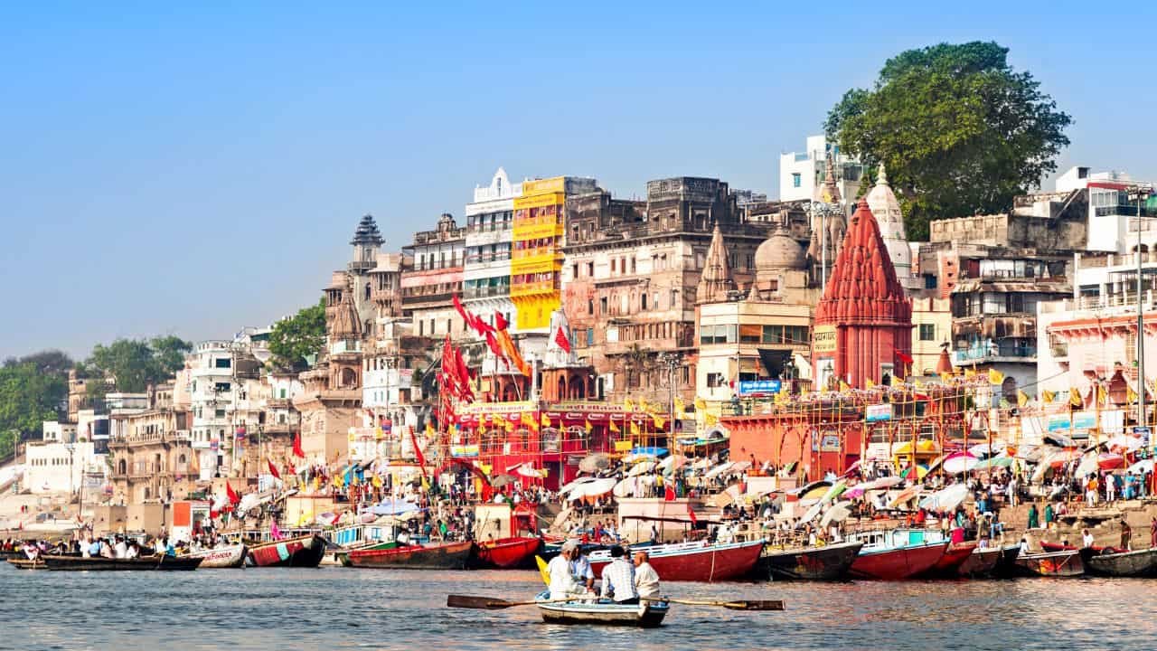 A-scenic-view-of-Varanasi-India-showcasing-the-Ganges-River-and-historic-temples-along-the-riverbank.jpg