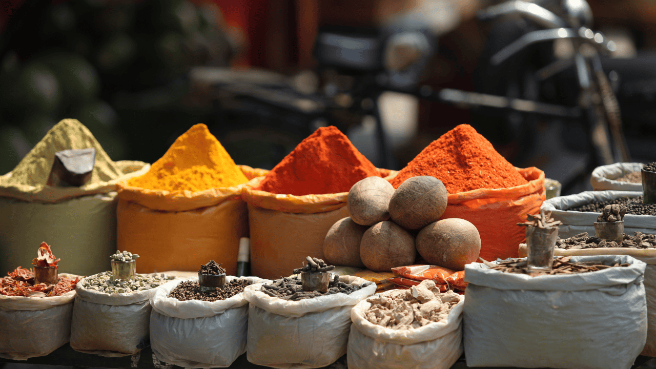 A-variety-of-colorful-spices-in-bags-showcasing-the-rich-culinary-heritage-of-Wayanad.png
