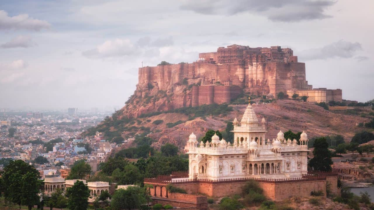 A-vibrant-cityscape-of-Jodhpur-India-featuring-the-iconic-blue-houses-and-the-historic-Mehrangarh-Fort-in-the-background.jpg