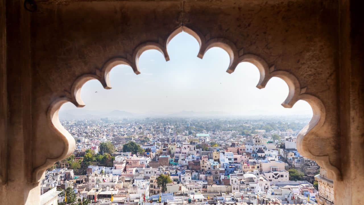 Scenic-view-of-Udaipur-India-from-an-old-buildings-window-highlighting-the-citys-unique-landscape-and-heritage.jpg