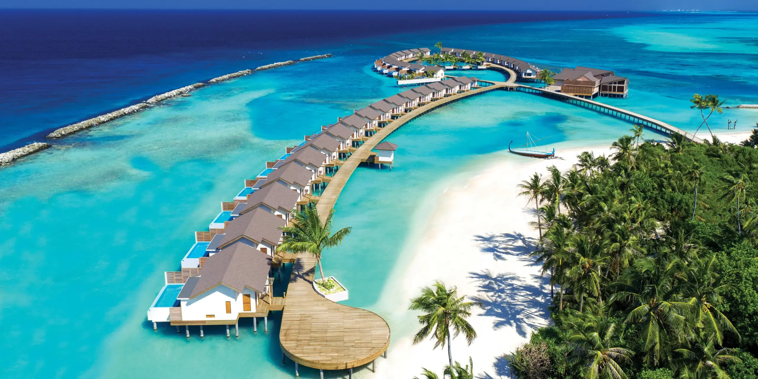 ATMOSPHERE-KANIFUSHI-MALDIVES-AERIAL-VIEW-WATER-VILLA-JETTY-02-scaled.webp
