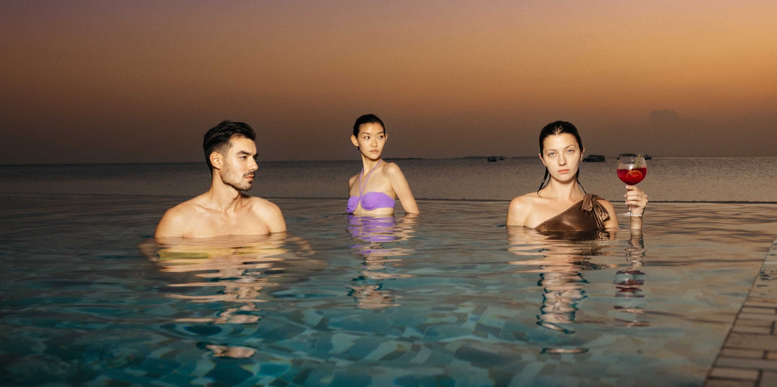 MLDSM-P0114-Lifestyle-Group-Of-Friends-Pool-Evening-Sunset.16x9.jpg